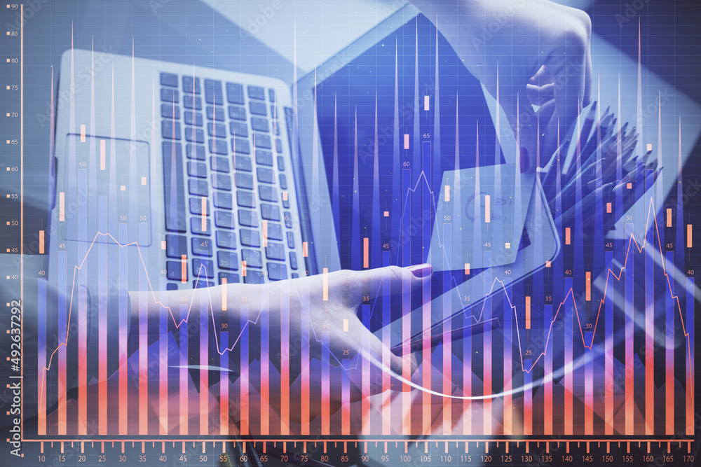Double exposure of businesswoman hands typing on computer and financial graph hologram drawing. Stock market analysis concept. Double exposure of businesswoman hands typing on computer and financial graph hologram drawing. Stock market analysis concept.
