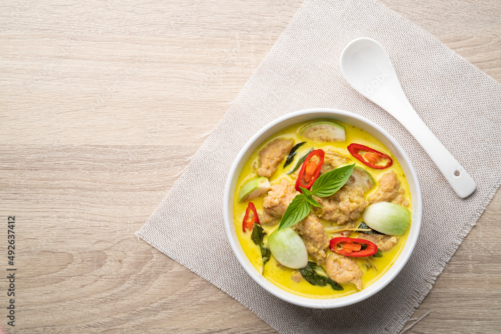 Thai Green Curry with Bouncy Pork and eggplant is a central Thai variety of curry (Gaeng Kiew Wan Moo Deng).Top view Thai Green Curry with Bouncy Pork and eggplant is a central Thai variety of curry (Gaeng Kiew Wan Moo Deng).Top view