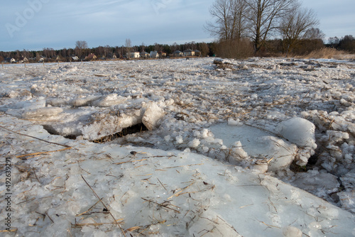 Impossible road covered with ice and snow on the river bank in Vecdaugava nature reserve in Latvia after winter floods, Where do you want to go today? photo