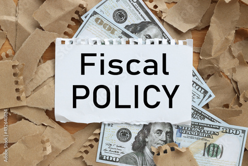 fiscal policy text on a white paper in the background of money
