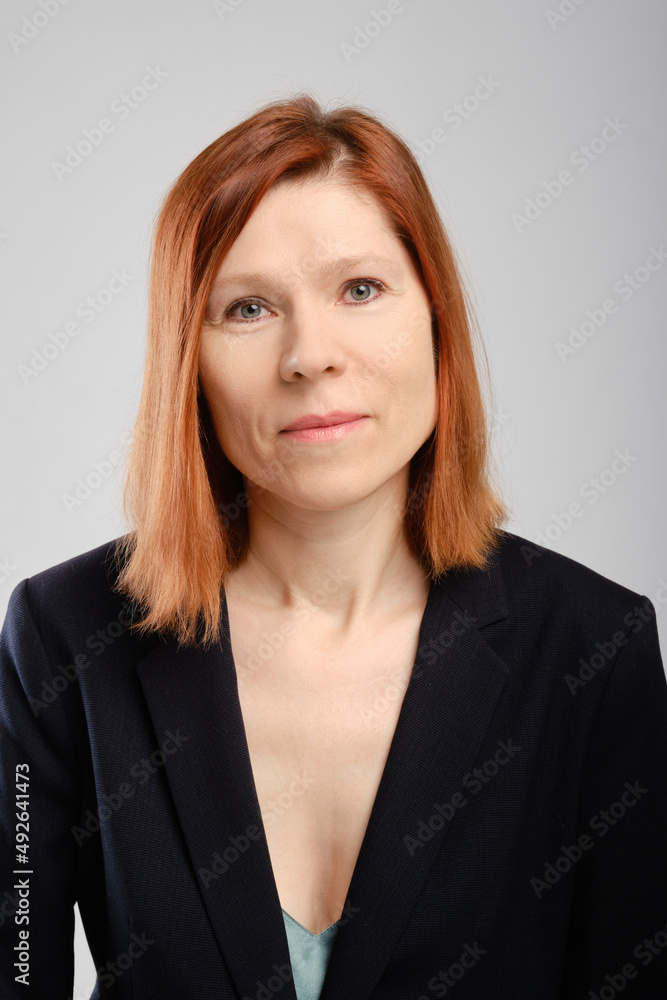 Closeup portrait of middle aged woman in suit Closeup portrait of middle aged woman in suit