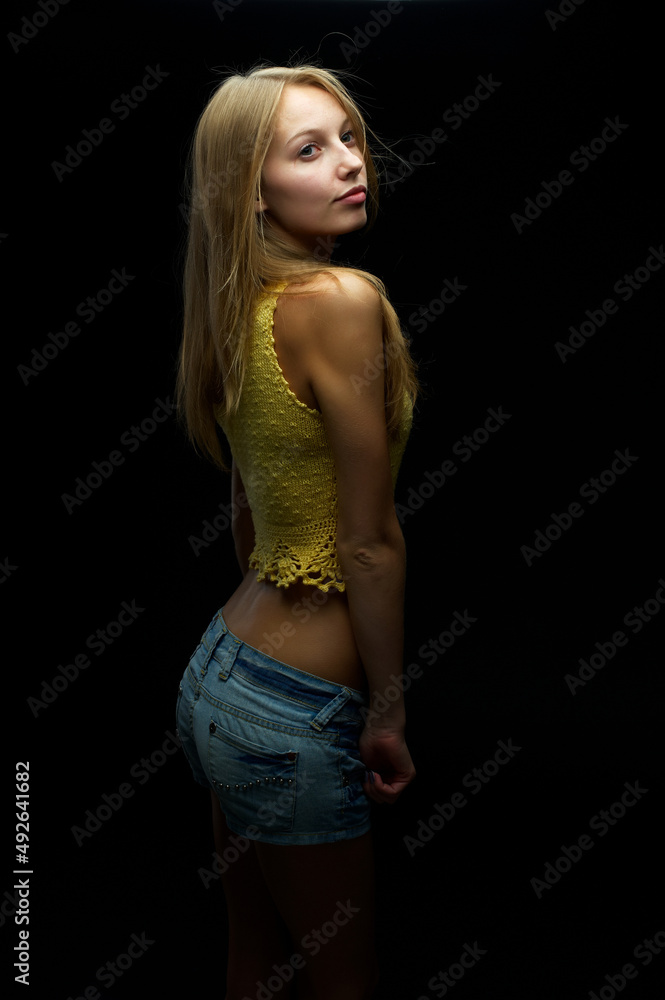 Young pretty woman with flower over black Young pretty woman with flower over black