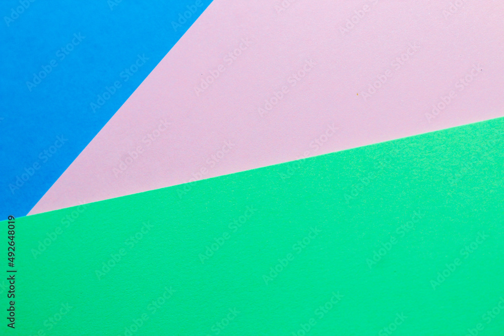 Abstract background with colored paper blue with pink and green color. Abstract background with colored paper blue with pink and green color.