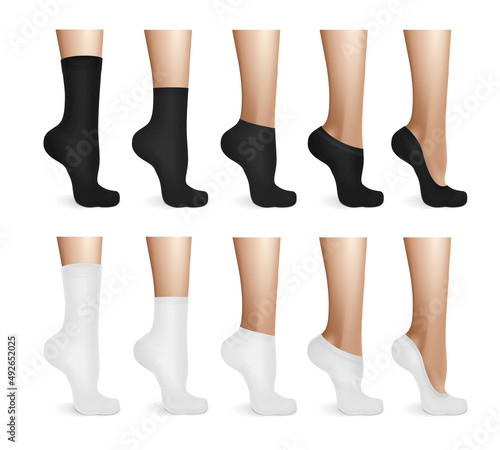 Female Legs In White And Black Socks