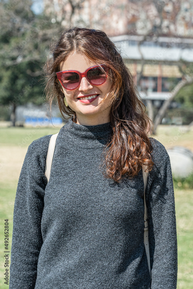 Happy female student enjoying a sunny day Happy female student enjoying a sunny day