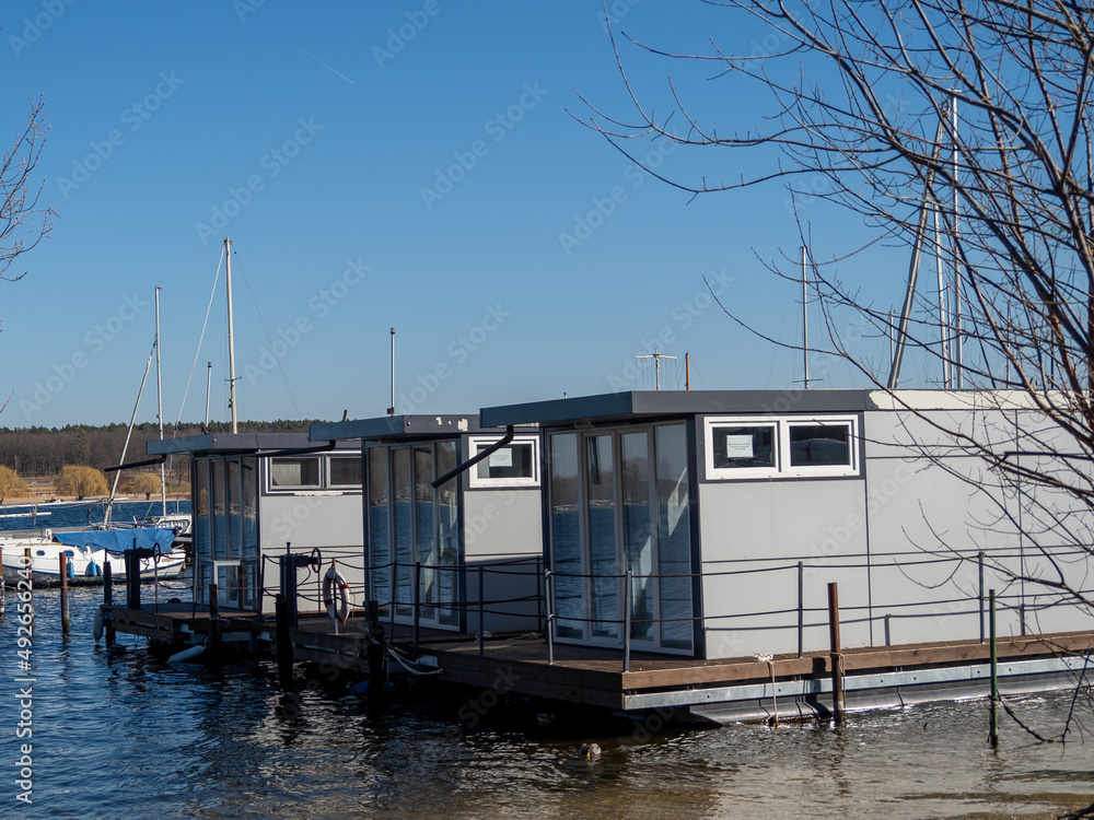 A houseboat on a city lake, a place for recreation and entertainment. A houseboat on a city lake, a place for recreation and entertainment.