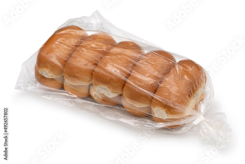 Plastic bag with traditional Dutch white soft buns isolated on white background