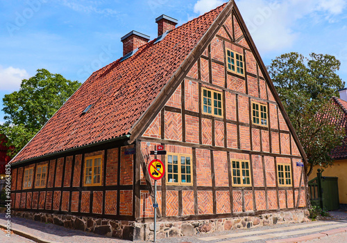 Old red brick house in the city in summer. High quality photo