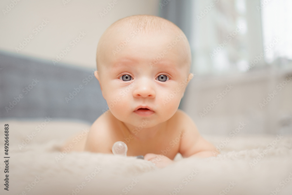 Funny and beautiful baby on the bed. children's health. Funny and beautiful baby on the bed. children's health.
