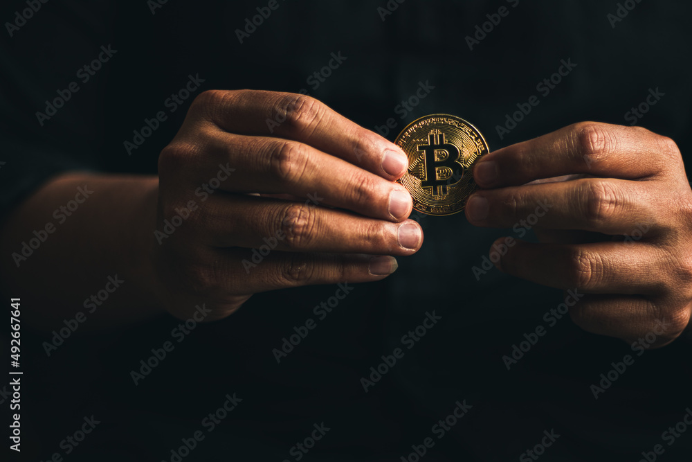 cryptocurrency golden bitcion. businessn holdig bitcoin for futer that price up. cryptocurrency golden bitcion. businessn holdig bitcoin for futer that price up.
