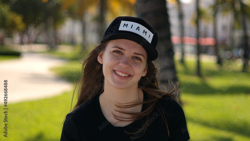 Young woman relaxes in the sun at the promenade of Miami South Beach Young woman relaxes in the sun at the promenade of Miami South Beach