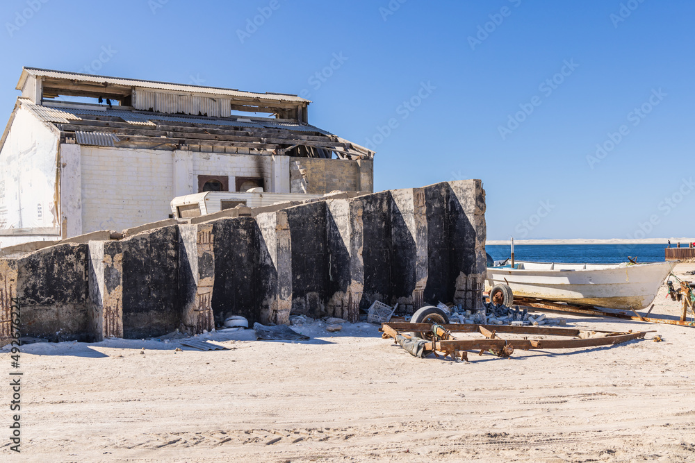 Boats and out buildings at an abandoned lighthouse on the western coast of the Baja peninsula. Boats and out buildings at an abandoned lighthouse on the western coast of the Baja peninsula.
