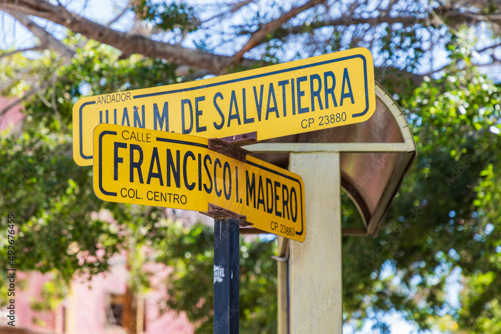 Street signs in the town of Loreto.
