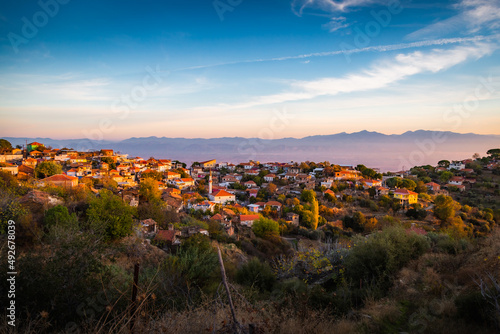 sunset over the mountains and village