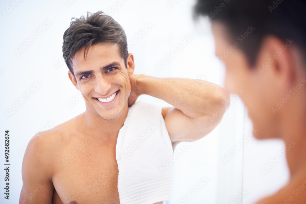 Feeling refreshed. A handsome man smiling after shaving.