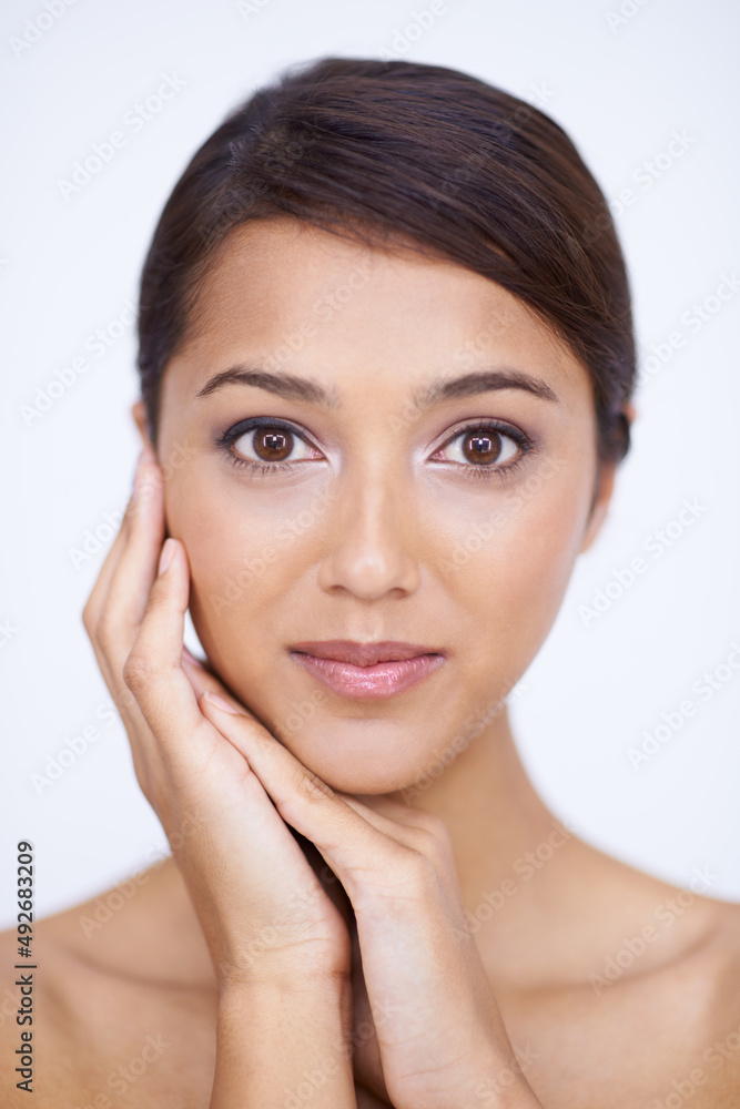 Flawless skin makes her undeniably beautiful. A gorgeous young woman feeling her smooth, soft skin in a studio shoot. Flawless skin makes her undeniably beautiful. A gorgeous young woman feeling her smooth, soft skin in a studio shoot.