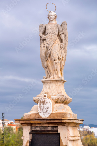 Statue of Saint Raphael in the middle of the Roman Bridge in Cordoba, Spain.