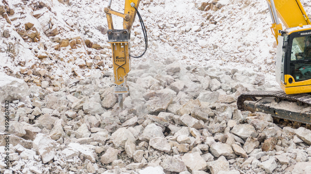 the excavator splits the stones. career equipment.