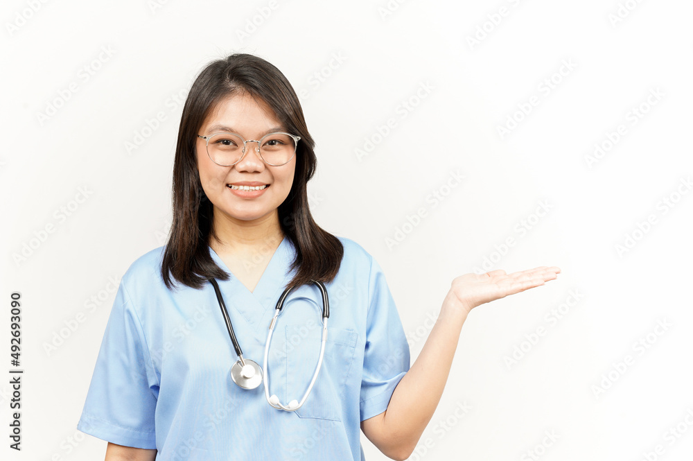 Presenting and Showing Product on Open Palm Of Asian Young Doctor Isolated On White Background Presenting and Showing Product on Open Palm Of Asian Young Doctor Isolated On White Background
