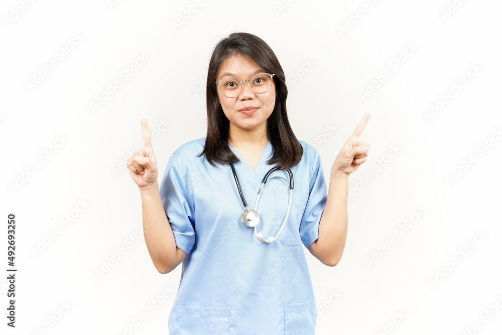 Showing Product and Pointing Up Of Asian Young Doctor Isolated On White Background Showing Product and Pointing Up Of Asian Young Doctor Isolated On White Background
