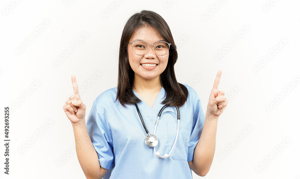 Showing Product and Pointing Up Of Asian Young Doctor Isolated On White Background Showing Product and Pointing Up Of Asian Young Doctor Isolated On White Background