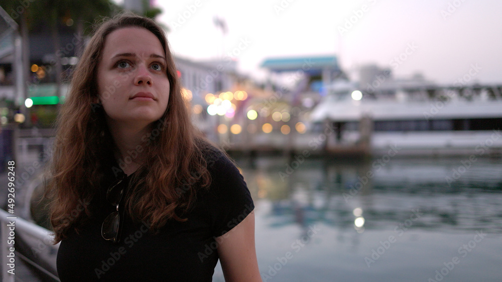 Young woman at Miami Bayside - close up shot in the evening