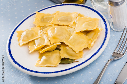 Delicious appetizing ravioli with bay leaf and black pepper