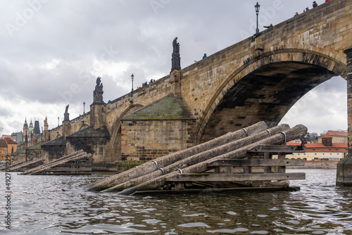 Photography Wooden Icebreakers in front of the pillars of the Charles Bridge, Prague