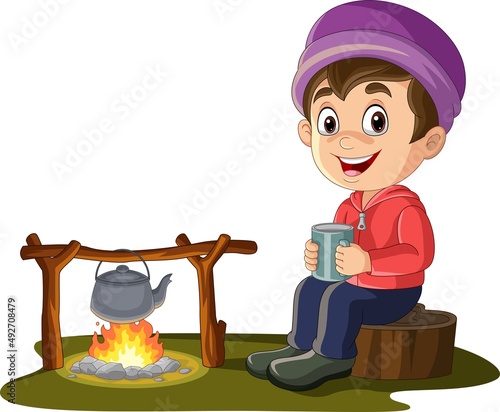 Cartoon little boy sitting on tree stump near campfire with drinking hot tea