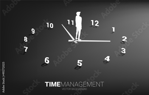 Silhouette of businessman standing with clock. Concept for office employee and working time.