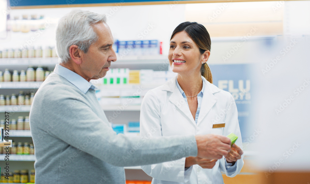 I think you chose well. Shot of a pharmacist assisting a customer in a chemist.