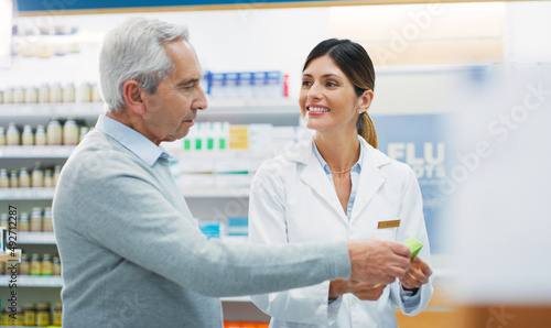 I think you chose well. Shot of a pharmacist assisting a customer in a chemist.