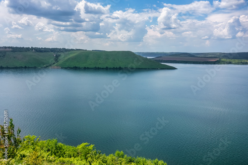 Magnificent aerial view on small tributary of the Dniester River with picturesque shores. National Nature Park Podilski Tovtry  the Dniester River  Ukraine. Beautiful view from flying drone.