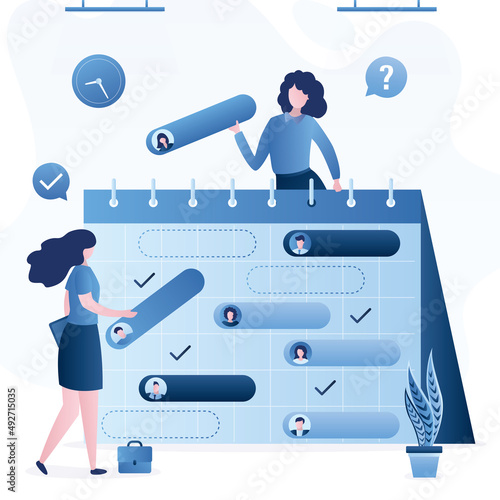 Time management, planning events. Business women plan work schedule for month. Managers make the timetable. Business persons and time optimization, planning schedule. Teamwork.
