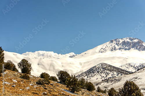 Scenic view of Kızlarsivrisi mountain, 3070 meter high, which is very popular for mountaineering, Elmalı, Antalya photo