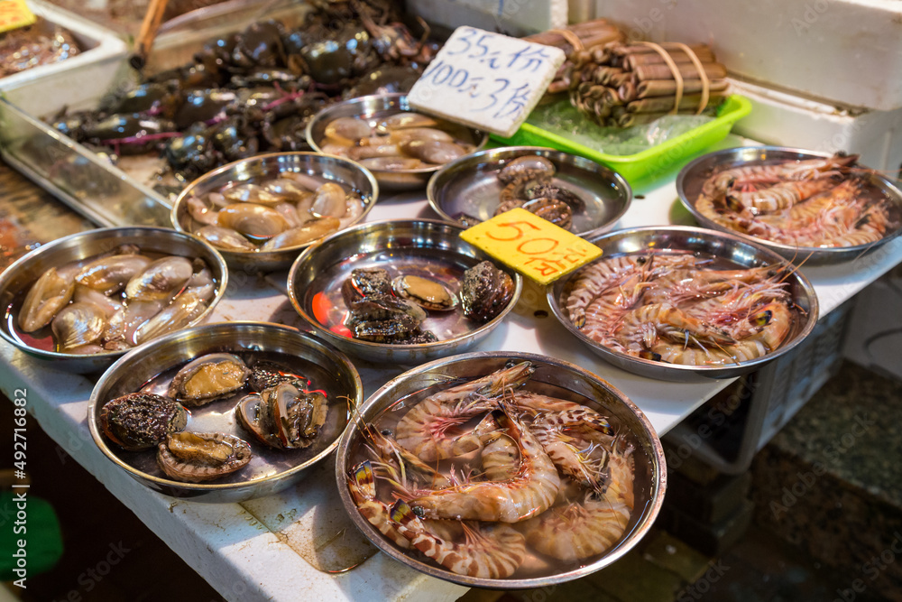 Clams, shrimps and other seafood being sold at a wet market in Hong Kong, China.