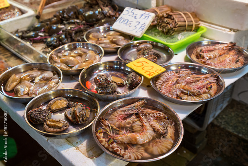 Clams, shrimps and other seafood being sold at a wet market in Hong Kong, China.