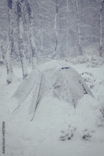 Extreme cold weather. Сlimbing tent under the snow.