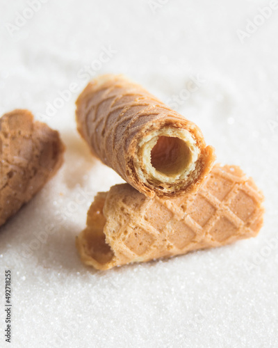 Homemade wafer rolls. Thin and Crispy Waffle. Selective focus. photo