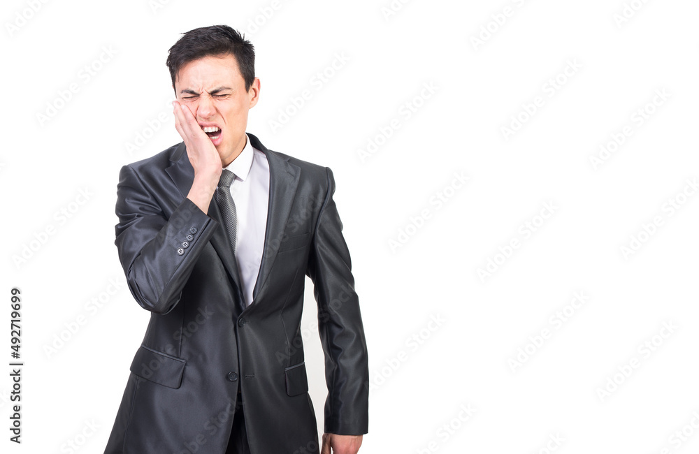 Formally dressed man closing eyes from toothache Formally dressed man closing eyes from toothache