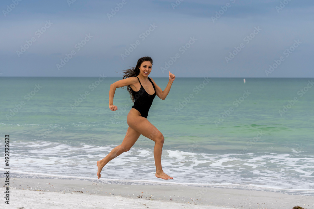 Lovely Mixed Race Bikini Model Posing Outdoors On A Caribbean Beach