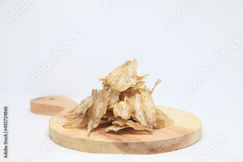 Dried fish on a wooden tray