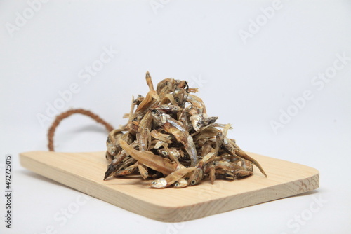 Dried anchovy on a wooden tray