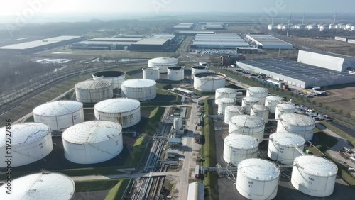 Commercial petrochemical oil gas fuel storage crude energy silos terminal at large industrial port. Huge storage of liquid aerial drone view in the port of Amsterdam, The Netherlands. photo