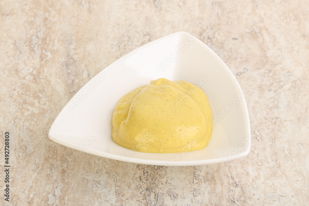 Organic mustard sauce in the bowl