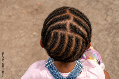 High angle view of young girl with braided hair photo