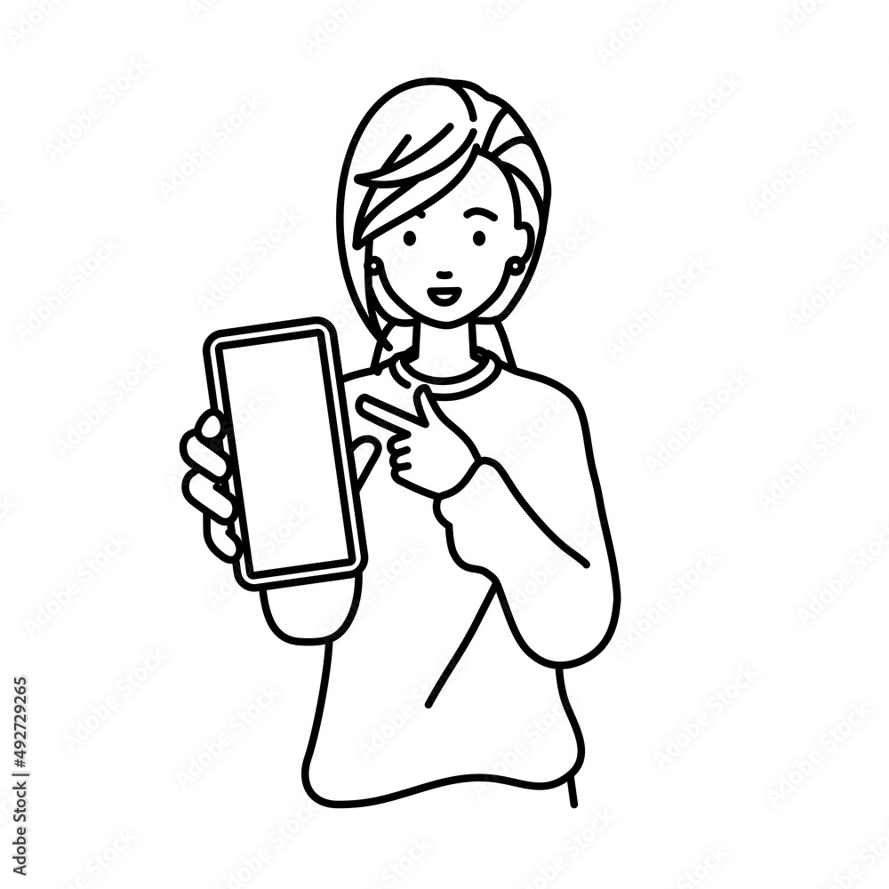 立ってスマートフォンを指差してこちらに向けて見せているリモートワークの女性 立ってスマートフォンを指差してこちらに向けて見せているリモートワークの女性
