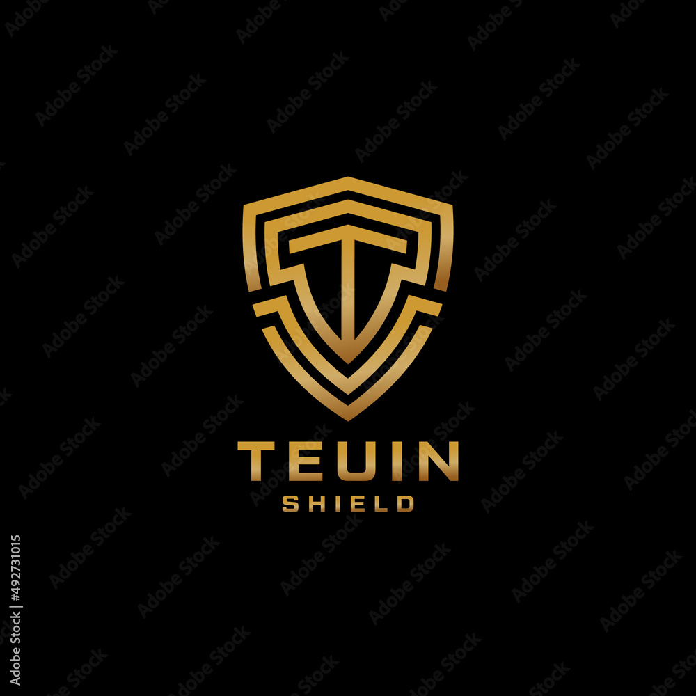 Letter T Logo With Shield Shape In Gold Color