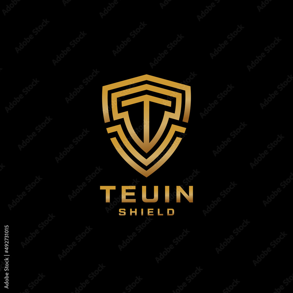 Letter T Logo With Shield Shape In Gold Color Letter T Logo With Shield Shape In Gold Color