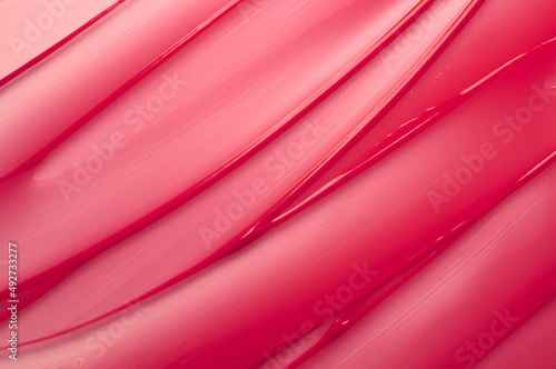 Lip gloss red colored smudge background texture